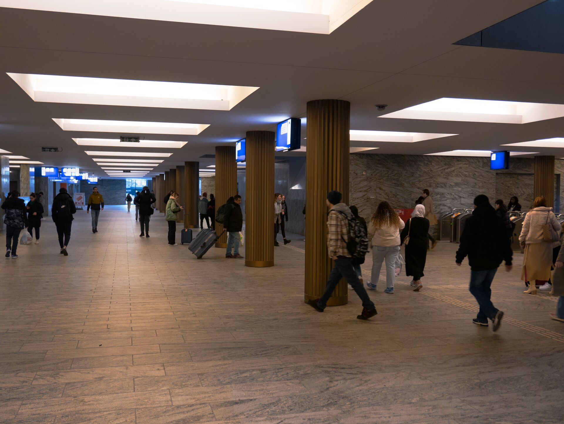 A spacious contemporary passage with rhythmic lighting