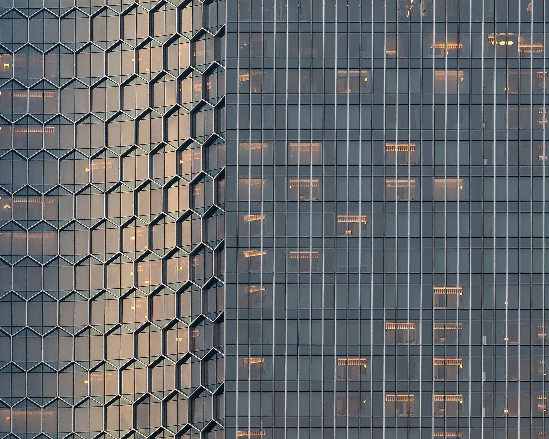 Warm light on a rhythmic facade at dusk