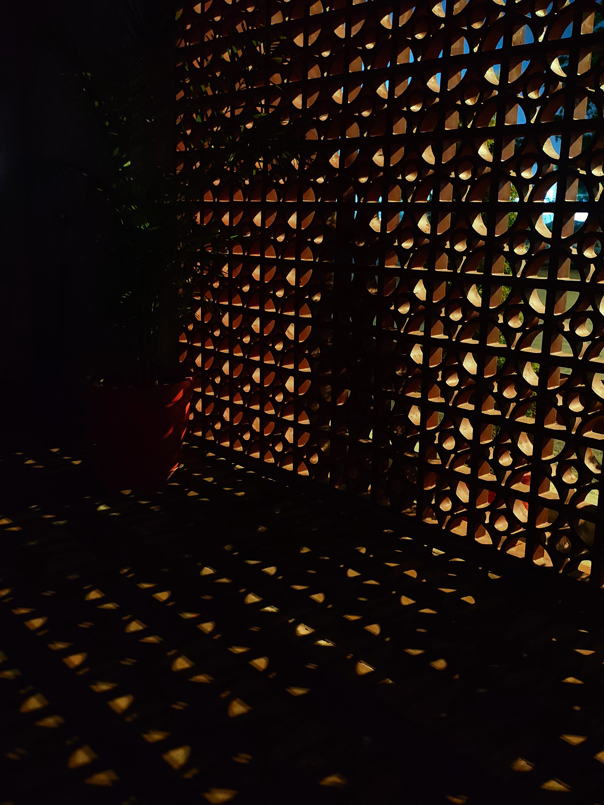 A geometric pattern of light and shadow across architecture